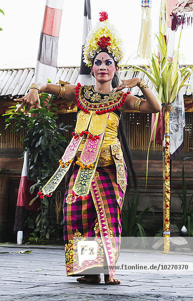 Balinese dancer using codified hand positions and gestures at a Barong dance performance in Batubulan  Bali  Indonesia