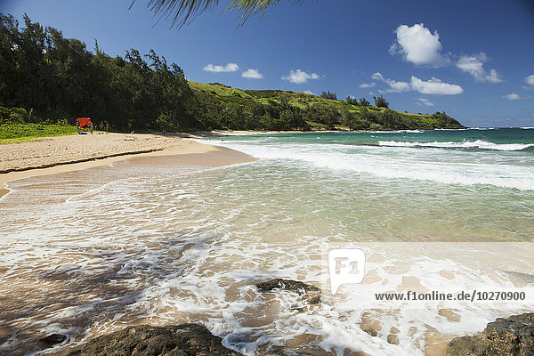 Sand  surf  white water at an isolated beach  Moloaa Beach and Bay; Kauai  Hawaii  United States of America