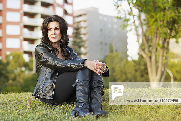 'Portrait of a mature woman outdoors in an urban setting; Edmonton  Alberta  Canada'