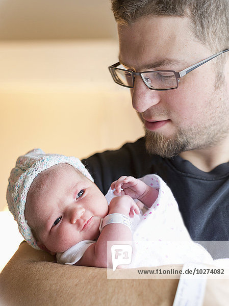 'A father with his newborn daughter; Chilliwack  British Columbia  Canada'