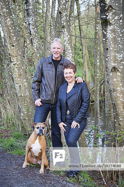 'Portrait of a couple with their dog; British Columbia  Canada'