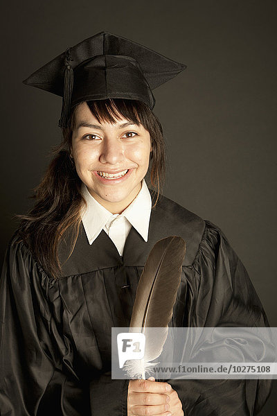 'Young woman in graduation cap and gown; Edmonton  Alberta  Canada'