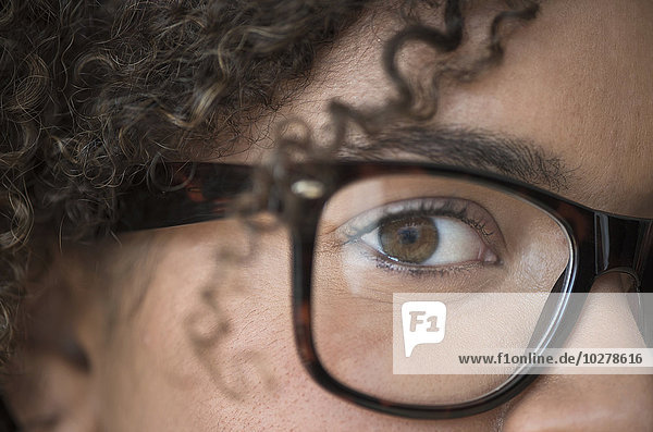 Close up of young woman in nerdy glasses