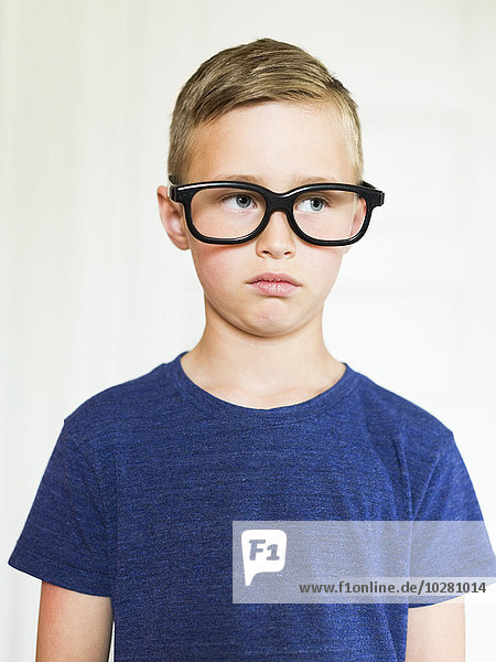 Portrait of boy (6-7) wearing eyeglasses