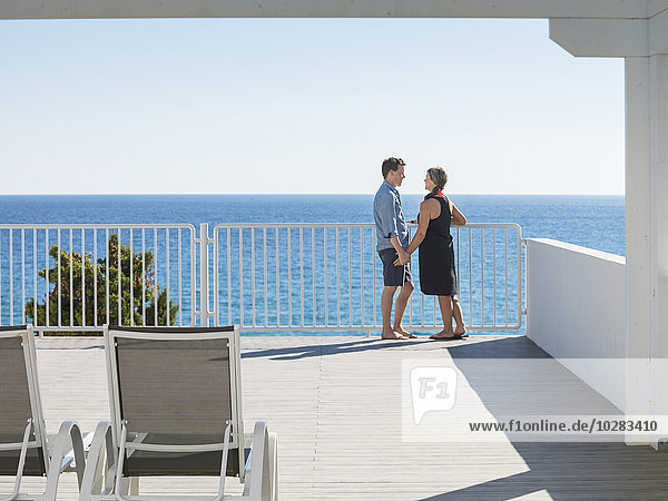 Couple on terrace at sea