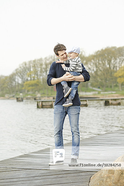 Father with son on jetty