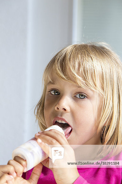 Girl eating ice-cream  Kiel  Schleswig-Holstein  Germany  Europe