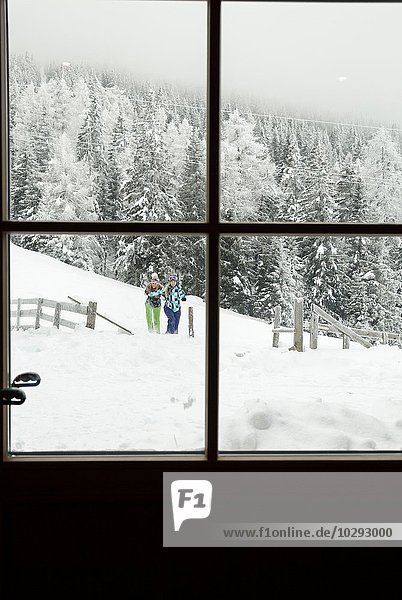 View of snow-covered forest through window  Sattelbergalm  Tirol  Austria