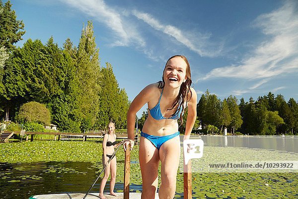 Girls in bikini having fun at lake  Seattle  Washington  USA
