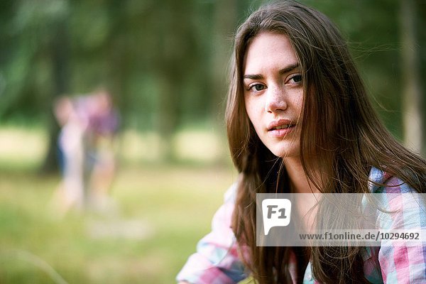 Portrait of teenage girl in woodland
