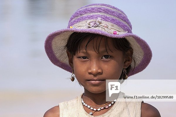 Local girl with pink hat  earrings and necklace  portrait  Ngapali  Thandwe  Rakhine State  Myanmar  Asia