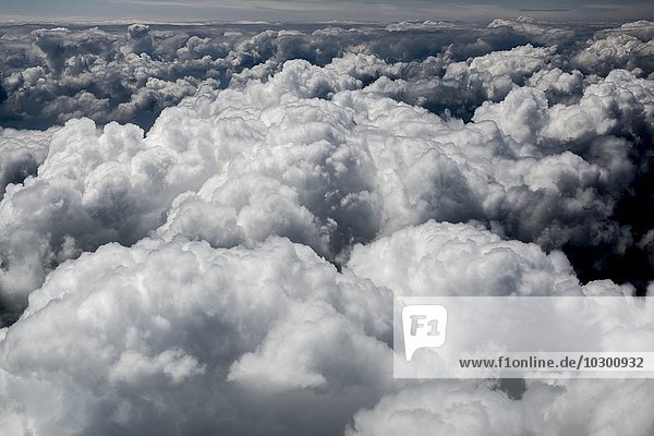 Large fluffy cumulus clouds  above the clouds  cloud cover  Germany  Europe