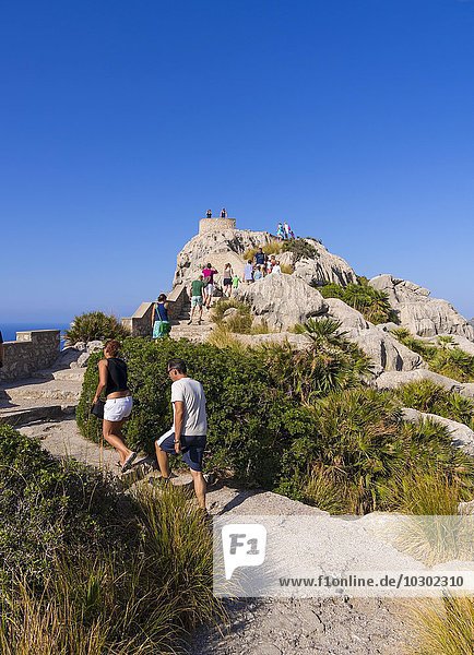 Visitors at Mirador d'Es Colomer or Mirador del Mal Pas  Cap de Formentor  Majorca  Balearic Islands  Spain  Europe