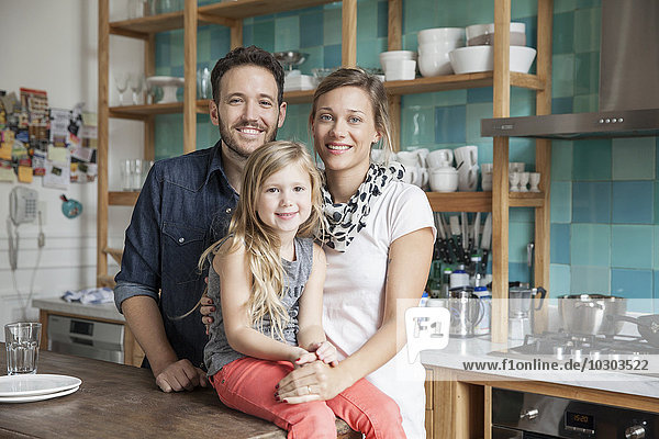 Family at home together in kitchen  portrait