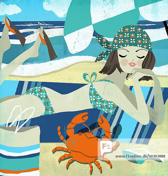 Junge Frau als Krebs-Sternzeichen im Bikini am Strand schaut auf eine Krabbe