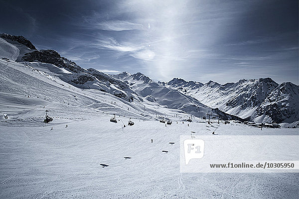 Austria  Tyrol  Ischgl  chair lift in winter landscape in the mountains