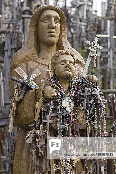 Lithuania  Siauliai  statue over and over covered with crosses at the Hill of Crosses