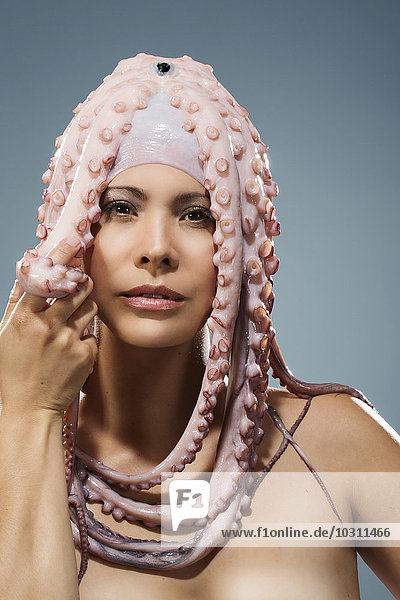 Portrait of woman wearing octopus headdress