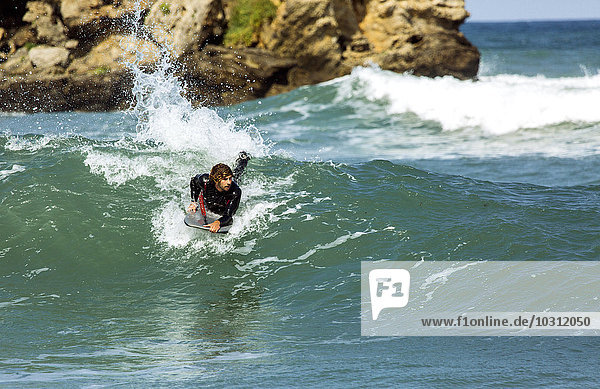 Spain  Asturias  Colunga  body board rider on the waves