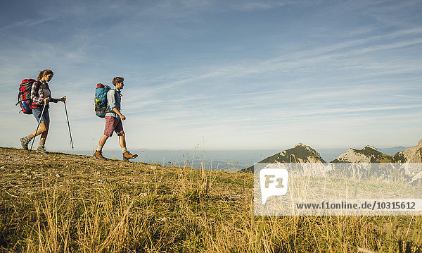 Austria  Tyrol  Tannheimer Tal  young couple hiking