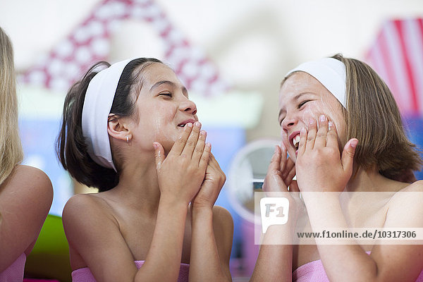 Two girls on a beauty farm pampering themselves