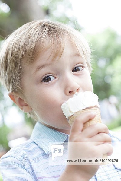 MODEL RELEASED. Boy eating an ice cream. Boy eating an ice cream