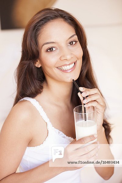 MODEL RELEASED. Woman drinking milk. Woman drinking milk
