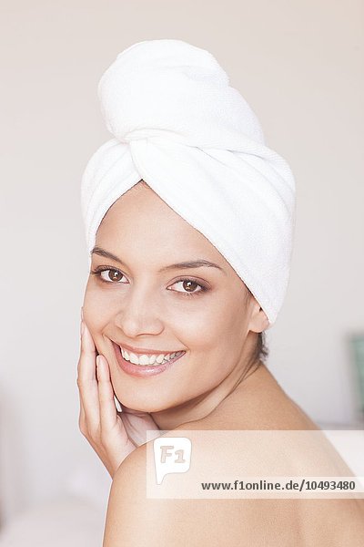 MODEL RELEASED. Woman with her hair in a towel. Woman with her hair in a towel