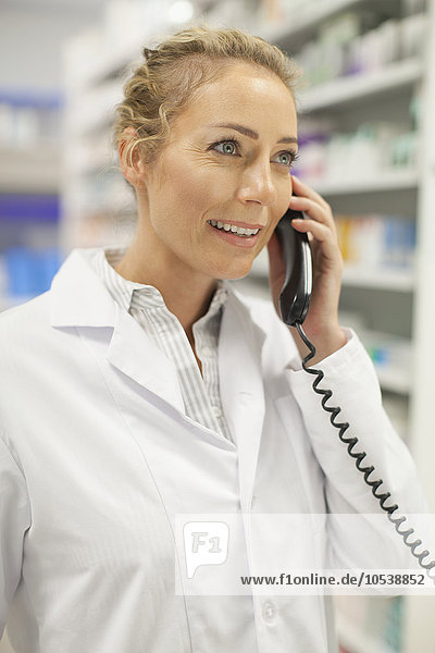 Pharmacist talking on phone