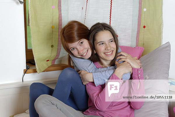 Girls  hugging  friendship  Upper Bavaria Germany