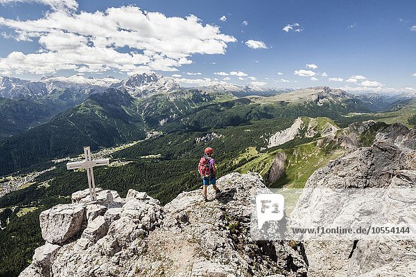 'Mountaineer reaching the top of Cima d'Auta on the Via Ferrata Paolin Piccolin at Colmean  behind the Pala  Falcade  Via Ferrata in Biois  Dolomites  Province of Belluno  Alps  Italy  Europe'