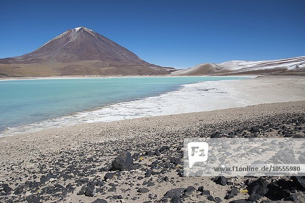 Laguna Verde with deposits of borax on the shore and snow on the mountains  near Uyuni  Altiplano  border to Bolivia  Chile  South America