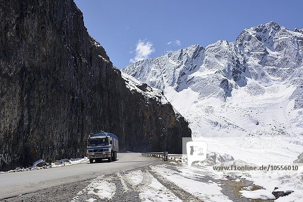 Truck on snowy Death Road  Camino de la Muerte  La Cumbre Pass  road between La Paz and Coroico  Bolivia  South America