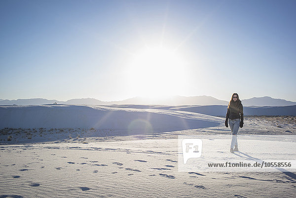 Caucasian woman walking in White Sands National Park  New Mexico  United States