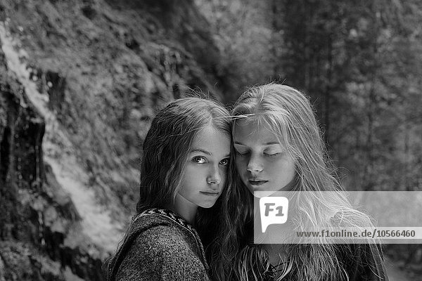 Caucasian teenage girls in forest