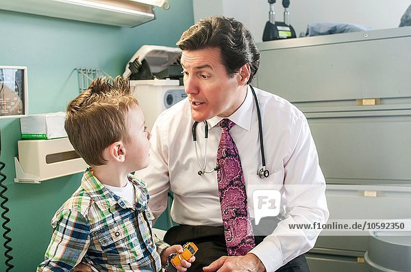 Young boy having check-up in doctor's office
