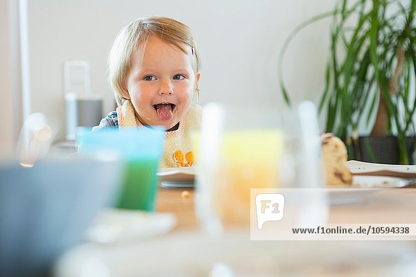 Female toddler at tea table