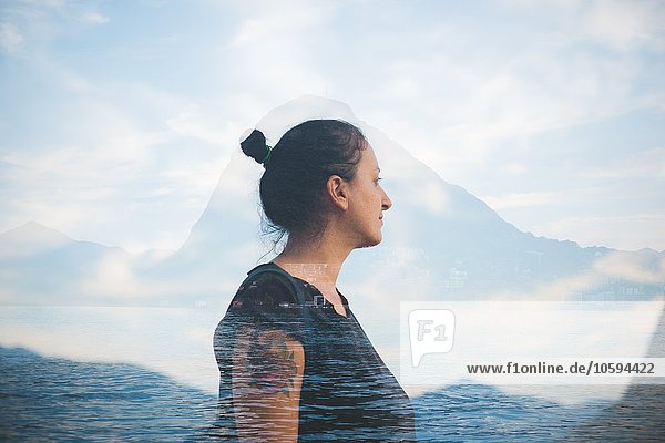 Doppelbelichtung einer erwachsenen Frau mit Blick auf den Luganer See  Schweiz