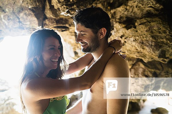 Romantic young couple in cave on Newport Beach  California  USA