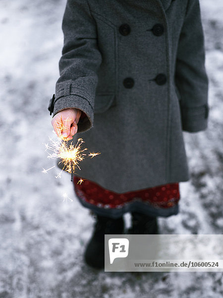 Girl playing with sparkler