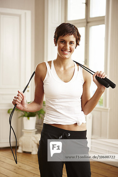 Woman holding skipping rope  portrait