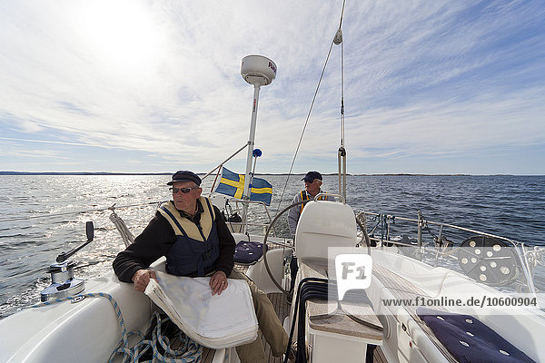 Senior men sailing
