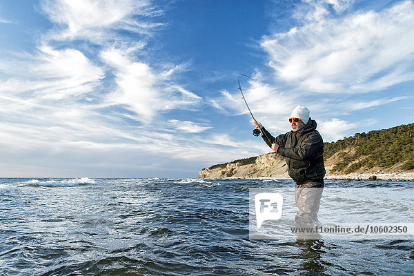 Man fishing in Baltic Sea  Gotland  Sweden