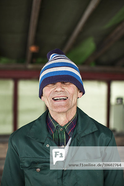 Portrait of senior man laughing