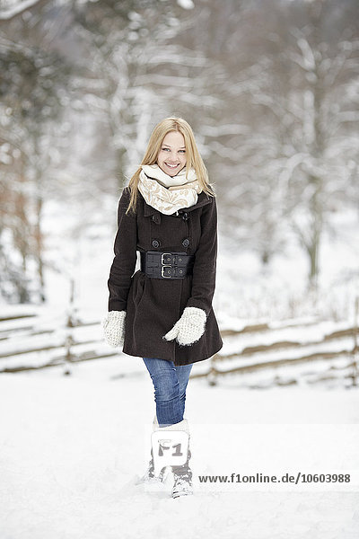 Smiling young woman at winter