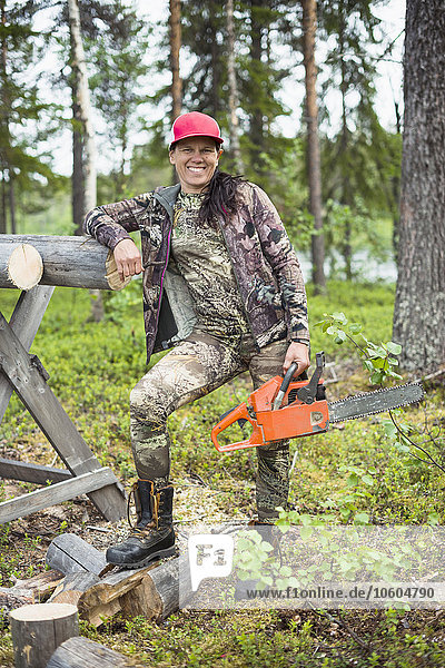 Woman with chainsaw