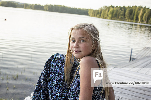 Girl sitting on jetty