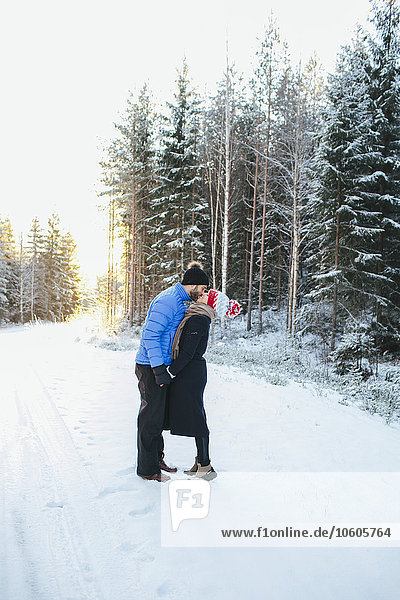 Couple kissing at winter