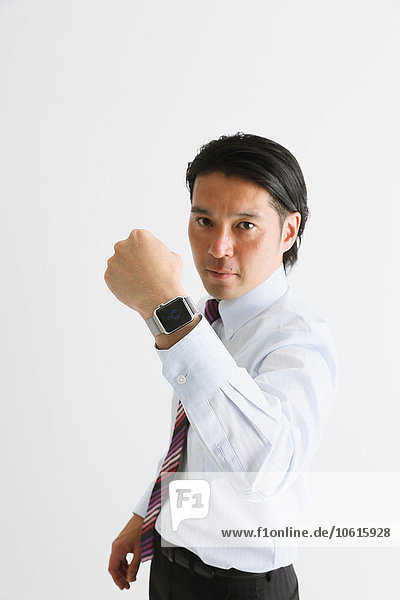 Japanese businessman with wearable smart watch