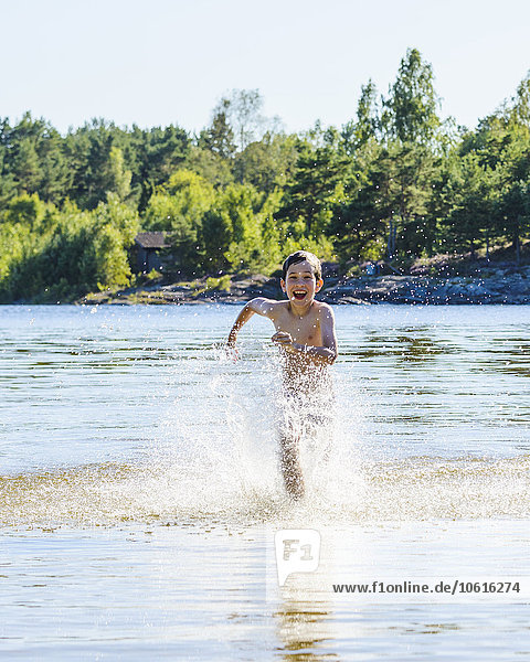Boy running in water